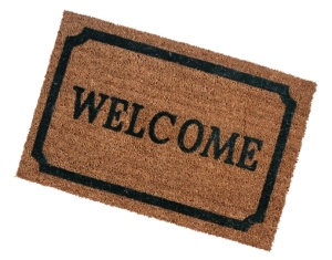 Doormat with the word welcome printed on it.